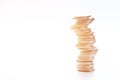 Coins stack on each other in different positions on white background Royalty Free Stock Photo