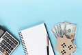 House model, American Dollar cash money, notebook and calculator on office desk table Royalty Free Stock Photo