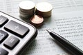 Coin stacks, calculator, pen and savings account passbook or financial statement on office desk table Royalty Free Stock Photo