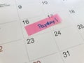 Calendar with pink paper with word payday for remind