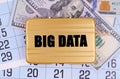 On the table lies a calendar, money and a briefcase with the inscription - BIG DATA