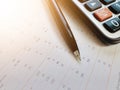 Calculator and pen on financial statements Royalty Free Stock Photo