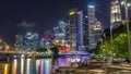 Business Financial Downtown City and Skyscrapers Tower Building at Marina Bay night timelapse hyperlapse, Singapore Royalty Free Stock Photo