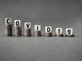 Business, Financial and Economic concept - COVID19 text on wooden blocks in vintage background. Stock photo