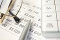 Business fountain pen, calculator and glasses on financial chart Royalty Free Stock Photo