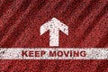Keep moving word on starting line with arrow on red road background