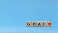 Business Goal. word GOAL written on wooden cube block stack on blue background Royalty Free Stock Photo