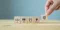 Business goals achievement concept with collaboration and teamwork. Businessman holds the wooden cube with symbols ; goals,  trust Royalty Free Stock Photo