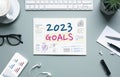 2023,business goals with text on notepad and office accessories