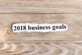 2018 business Goals text on paper. Word 2018 business Goals on torn paper. Concept Image