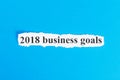 2018 business Goals text on paper. Word 2018 business Goals on torn paper. Concept Image