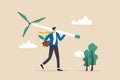 Business going green, environment eco friendly in climate change crisis or sustainability concept, smart businessman carrying wind Royalty Free Stock Photo