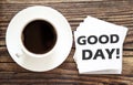 Business GOOD DAY . White stickers with text on the wooden background with coffee