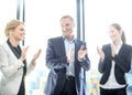Business group clapping and smiling Royalty Free Stock Photo
