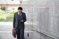 Business and grow up concept. Business man holding briefcase and walking up stairs going to work at morning in the city Royalty Free Stock Photo