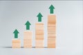 Business growth concept in 2020 with graph arrow increase, wood cube arrange as step, work process success