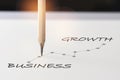 Business growth graph written on white paper with pencil Royalty Free Stock Photo