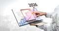 Business Growth Visualization with Laptop and Graphs Representing Future Trends from 2023 to 2026 in Urban Environment Royalty Free Stock Photo