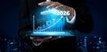 Business Growth Visualization with Male Executive Displaying Digital Graph for Future Projections in Urban Environment Royalty Free Stock Photo