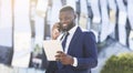 Business Guy Having Phone Conversation Using Tablet In City, Panorama Royalty Free Stock Photo