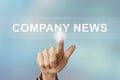 Business hand clicking company news button on blurred background