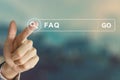 Business hand clicking FAQ or Frequently asked questions button Royalty Free Stock Photo