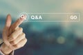 Business hand clicking Q&A or Question and Answer button on sear Royalty Free Stock Photo