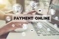 Business hand holding credit card with computer and word Payment Royalty Free Stock Photo
