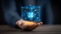 Business hand holding a digital data cube, symbolizing artificial intelligence and secure cloud computing. Royalty Free Stock Photo