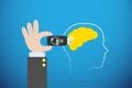 Business hand plugging lightbulb flash drive on yellow brain, idea and coaching concept