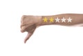 Business hand thumb down with yellow marker on five star rating. Royalty Free Stock Photo