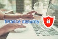 Business hand typing on a laptop keyboard with finance security
