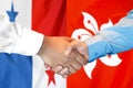 Handshake on Panama and Hong Kong flag background Royalty Free Stock Photo