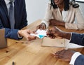 Business Handshake and Document Exchange in Office Setting Royalty Free Stock Photo