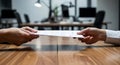 Business Handshake and Document Exchange in Office Setting Royalty Free Stock Photo