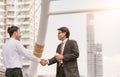 Business handshake. Handshake of two business men closing a deal city blackground. Royalty Free Stock Photo