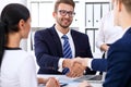 Business handshake at meeting or negotiation in the office. Partners are satisfied because signing contract or financial Royalty Free Stock Photo