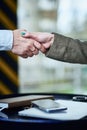 Business handshake men and women over laptop and phone. agreement, success and trust Royalty Free Stock Photo