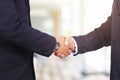 Business handshake. Two businessman shaking hands with each other in the office.. Royalty Free Stock Photo