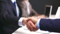 Business handshake. Two businessman shaking hands with each other in the office Royalty Free Stock Photo