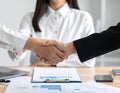 Business Handshake Between Two Professionals in Office Setting Royalty Free Stock Photo