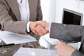 Business handshake. Two women lawyers are shaking hands after meeting or negotiation.