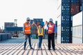 Business heir concept. Grandfather, Father and daughter are standing in Container cargo harbor. They are happy together because