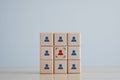 Focus red human icon on wooden block. Choice of employee leader from the crowd. Royalty Free Stock Photo