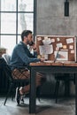 Business is his life. Thoughtful young man talking on the smart Royalty Free Stock Photo