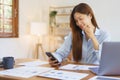 Business at home concept, Businesswoman reads data on smartphone to analysis market plan of startup