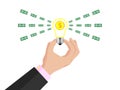 Business idea. A businessman holds a light bulb in his hand. Radiation, making money