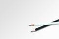 White pencil on the top of stacked pencils. Royalty Free Stock Photo