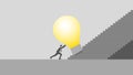 concept. A businessman pushes the big light bulb, Steps up a stair