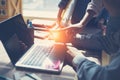 Business idea. Digital team discussing new working plan. Laptop and paperwork in open space office Royalty Free Stock Photo